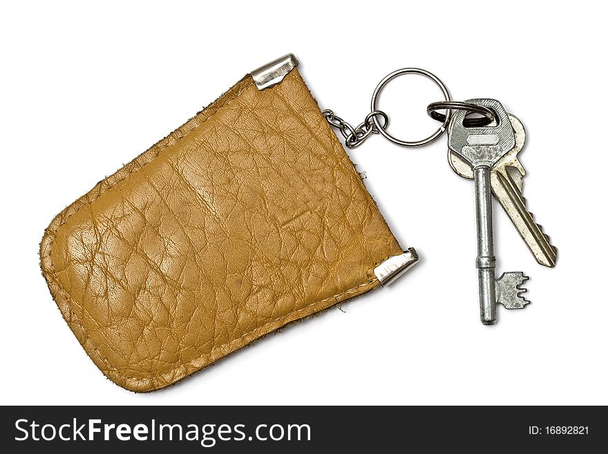 Keys and leather tag isolated on white background. Keys and leather tag isolated on white background