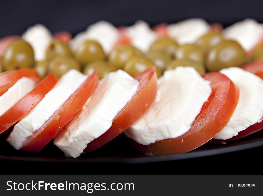 Mozzarella, tomatoes and olives - fresh and healthy food