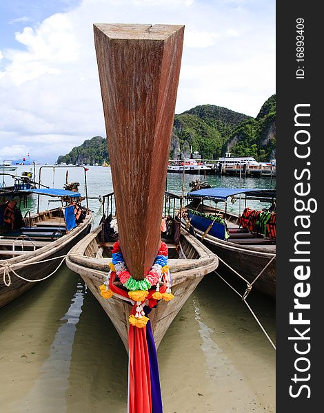 Long tail boat front, decorated with colorful ribbons, Thailand