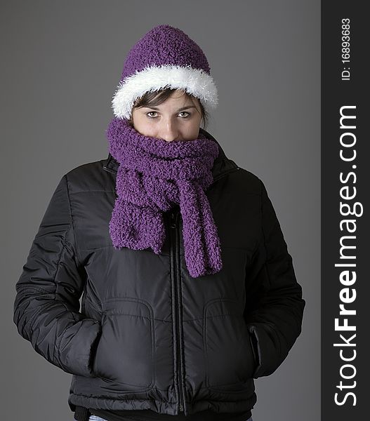 Young woman with purple bonnet , shawl and winter coat. Young woman with purple bonnet , shawl and winter coat