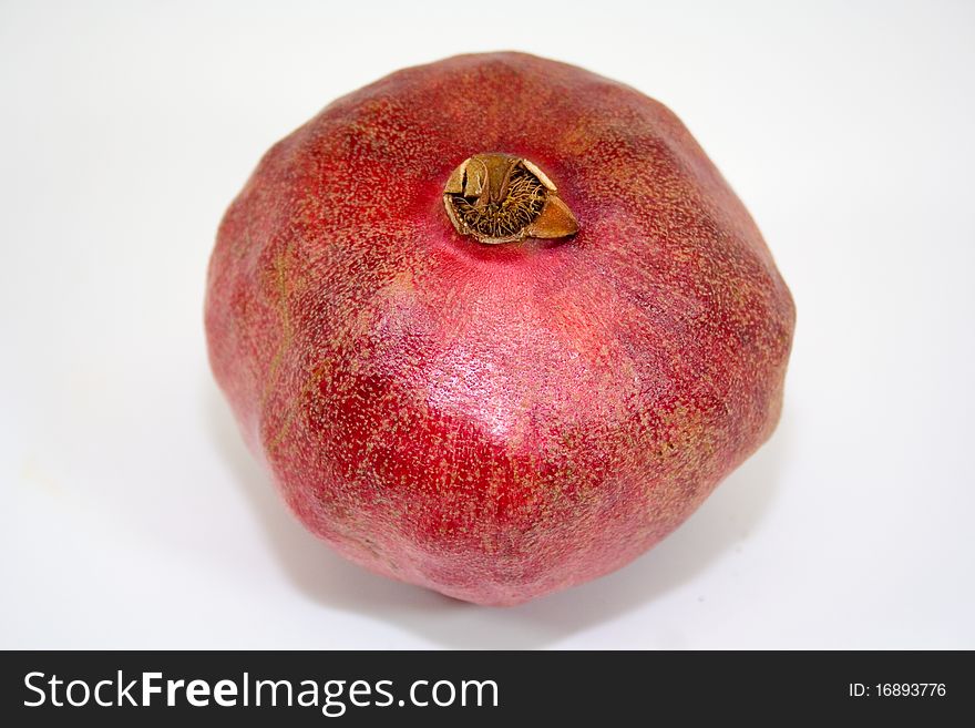 Bright red pomegranate on white background isolated