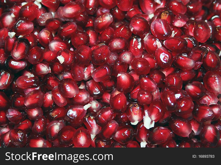 Juicy red pomegranate seeds for texture or background. Juicy red pomegranate seeds for texture or background