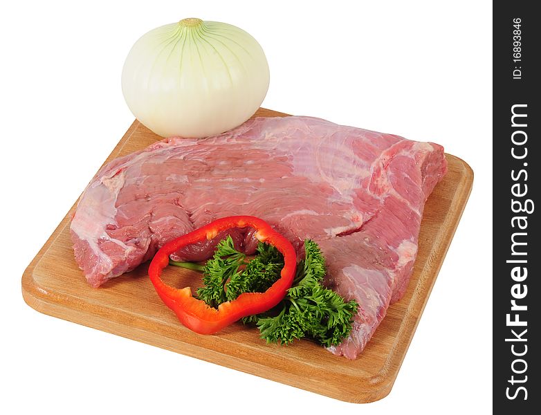 Meat and vegetables on a cutting board. Meat and vegetables on a cutting board.