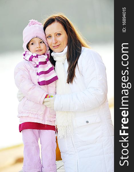 Young mother with daughter. Autumn day. Young mother with daughter. Autumn day