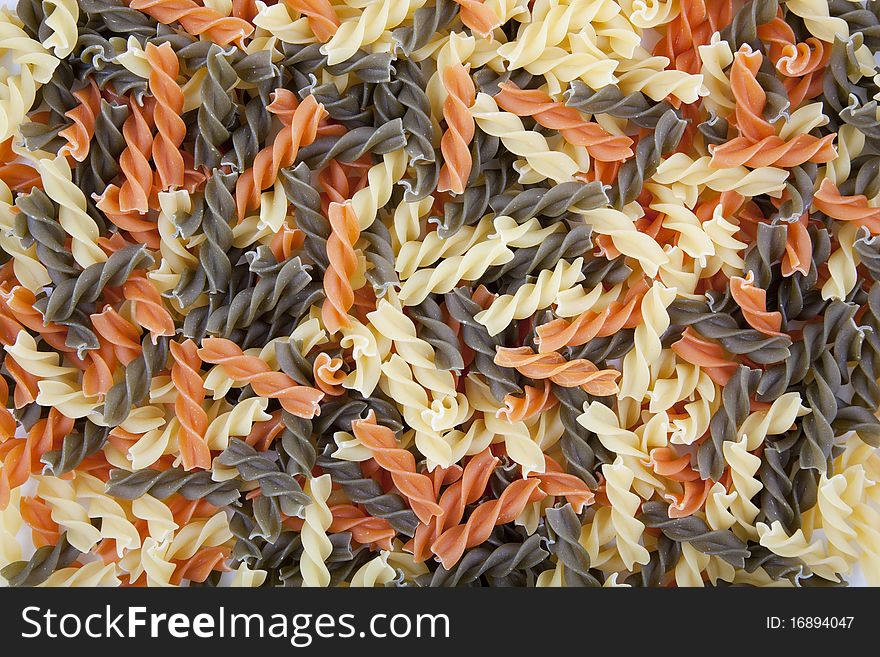 Three color spiral pasta background