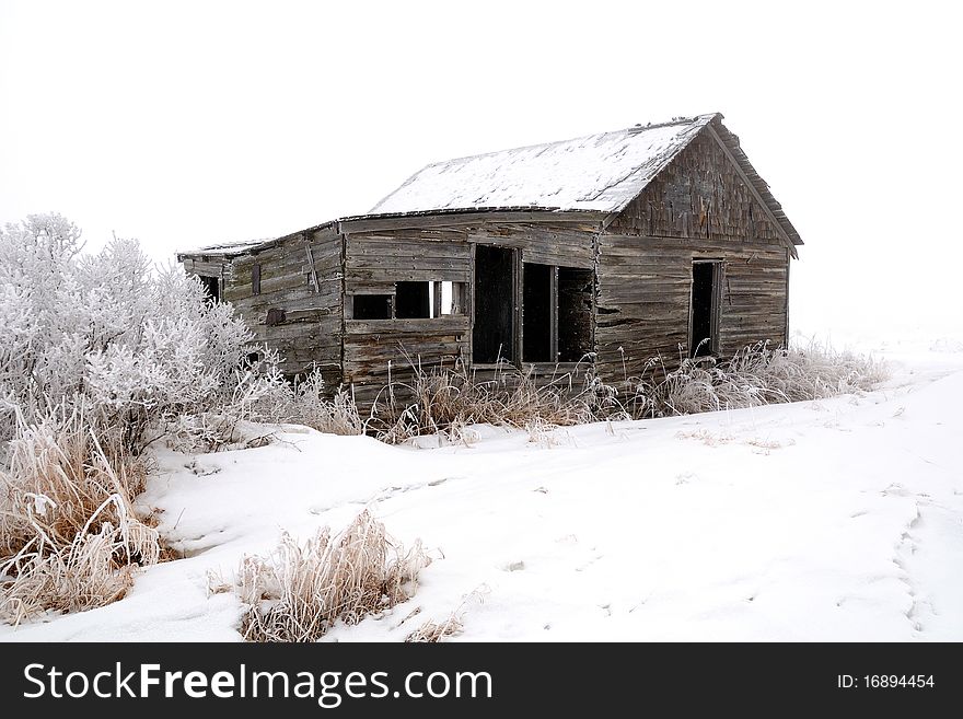 Abandoned Wood Farm Building In Winter