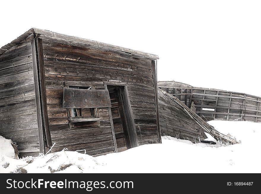 Abandoned Wood Farm Building In Winter