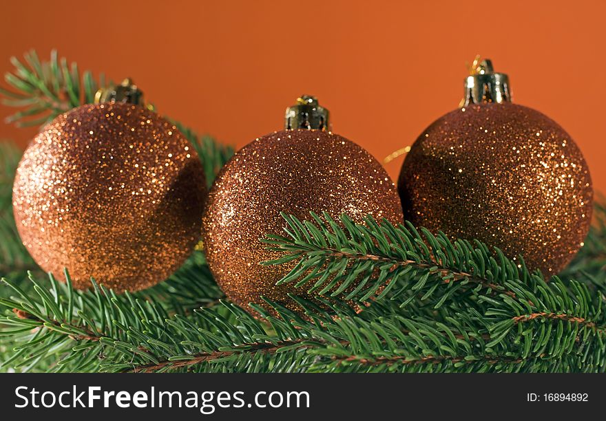 Christmas decoration, bronze christmas balls on spruce branch