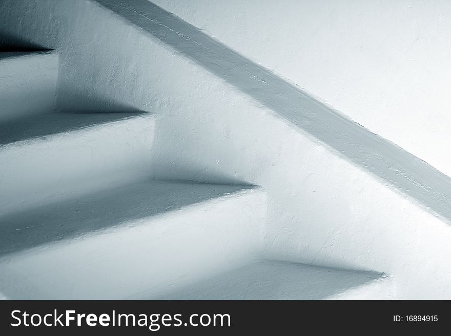 Closeup of white staircase to basement storey with copy space