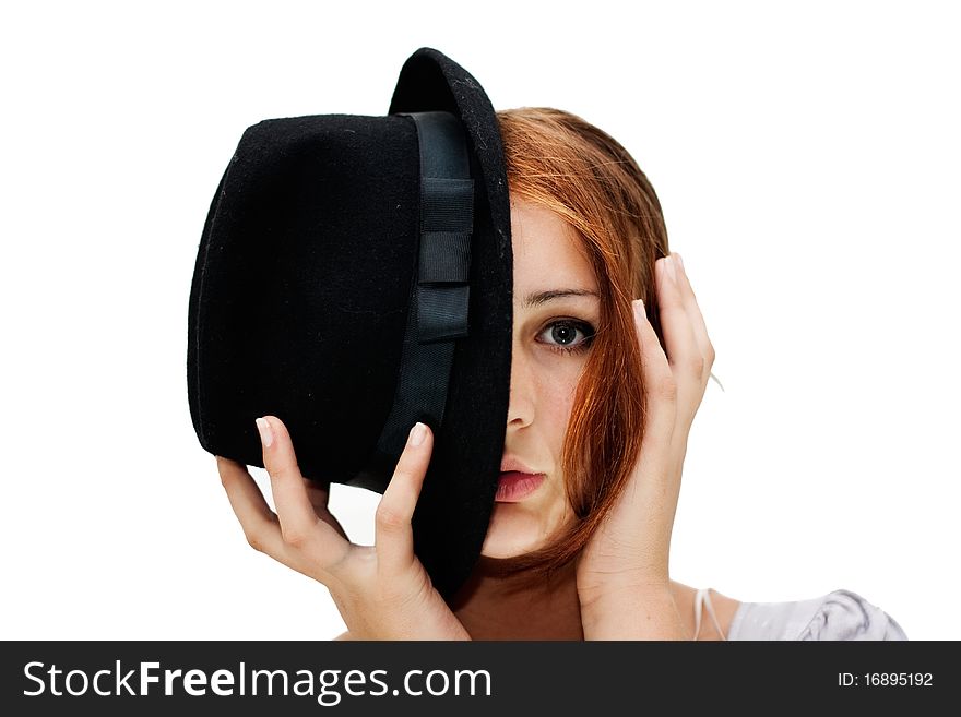 The girl with the black hat covering the half of the face, isolated on a white background. The girl with the black hat covering the half of the face, isolated on a white background