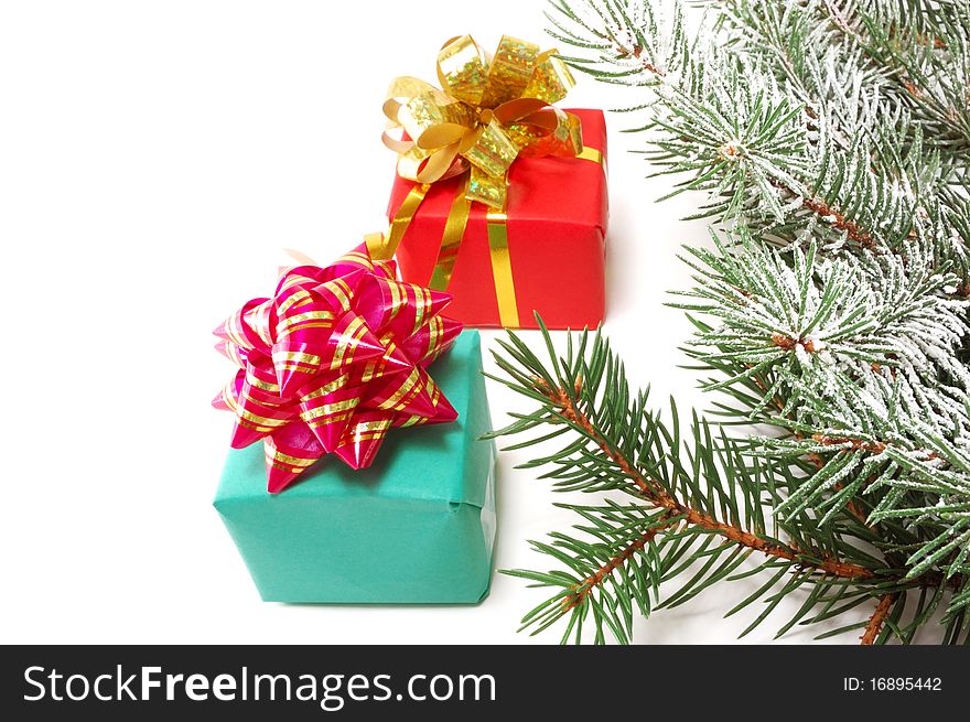 Gifts on fur-tree branches are isolated on a white background