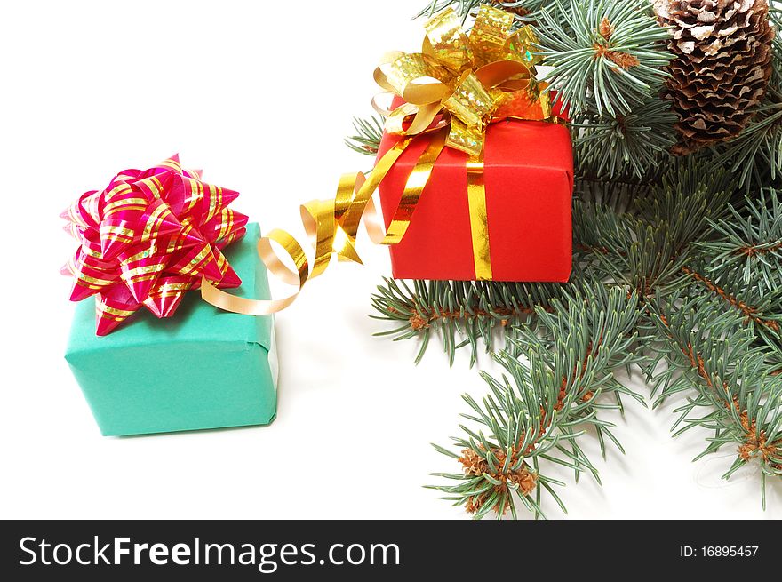 Gifts on fur-tree branches are isolated on a white background