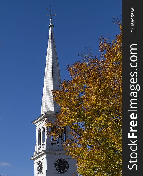 A Congregational church steeple thrusts above the fall foliage in Peacham, Vermont. A Congregational church steeple thrusts above the fall foliage in Peacham, Vermont.