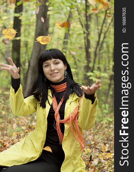 Beautiful Girl With Falling Leaves In The Autumn P