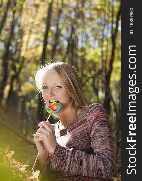 Woman Eating Candy Lollipops