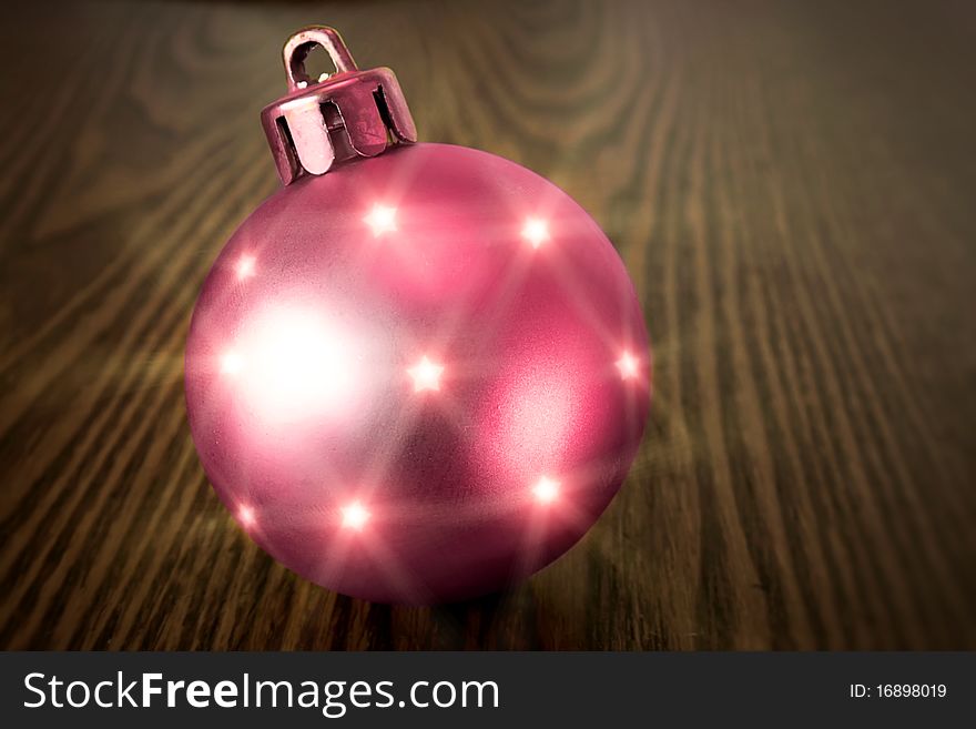 Christmas red ball on a wooden background