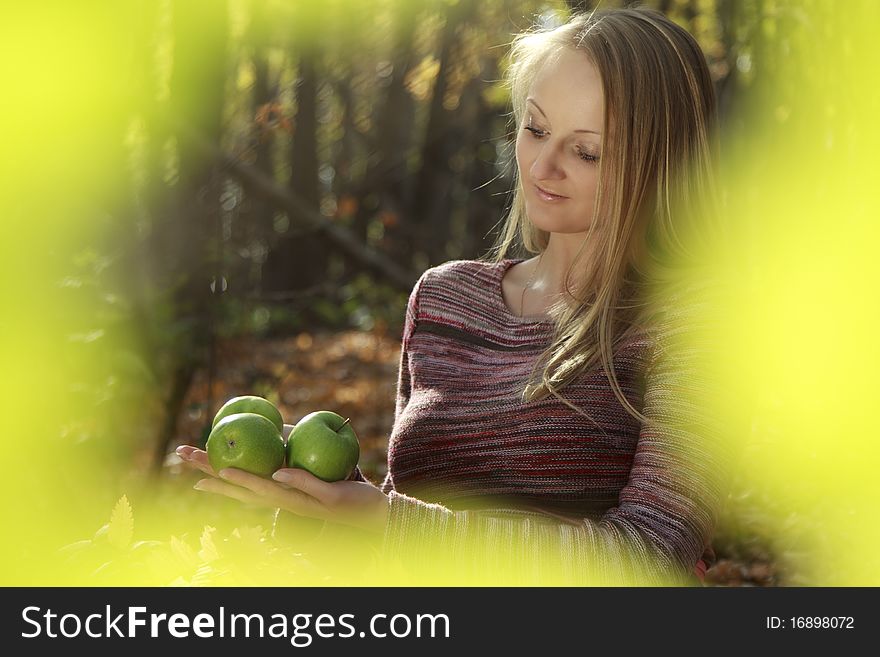 Portrait of a beautiful young woman Autumn Park.Blurred background. Portrait of a beautiful young woman Autumn Park.Blurred background.