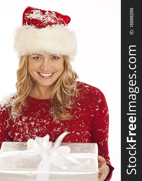 Woman in Santa hat holding present. Woman in Santa hat holding present