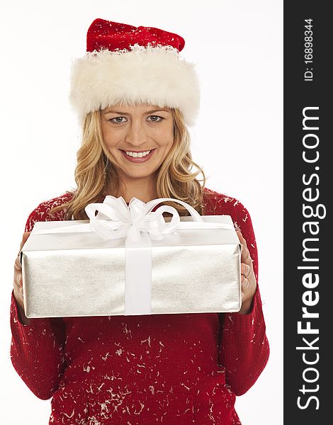 Woman in Santa hat holding present. Woman in Santa hat holding present