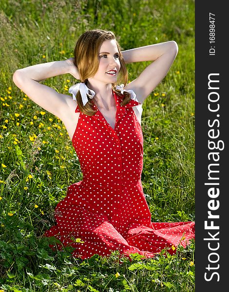 Beautiful model sitting in field of wild flowers. Beautiful model sitting in field of wild flowers