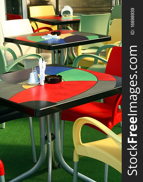 Colored Tables And Chairs At Cafe