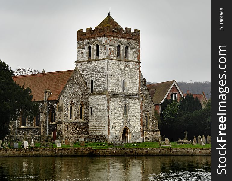 Historic Norman Church on the Banks of the River Thames in England. Historic Norman Church on the Banks of the River Thames in England