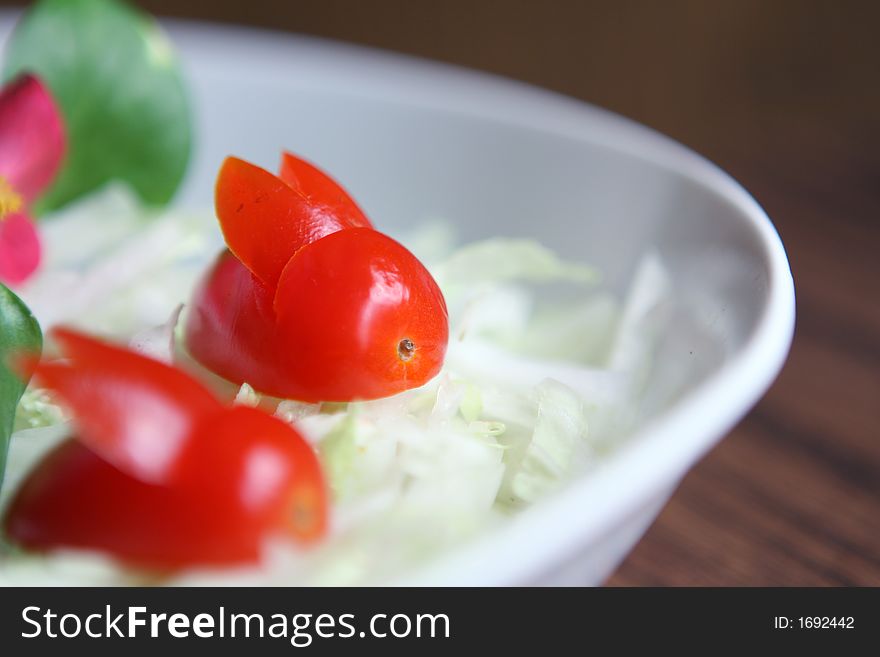 Two tomato rabbits and other vegetables in plate. Two tomato rabbits and other vegetables in plate.