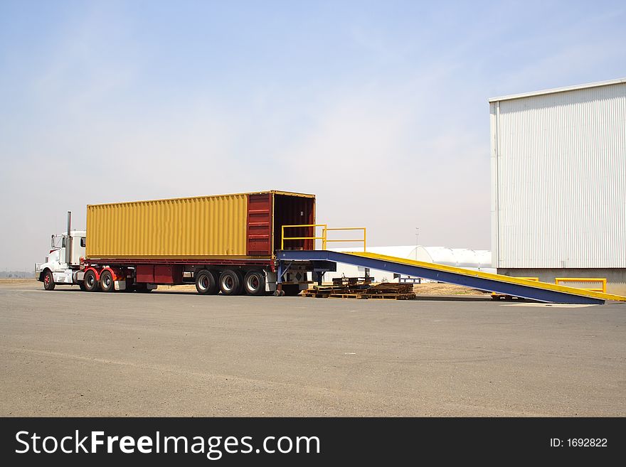 Large semi truck backed onto loading dock