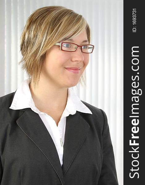 Beautiful smiling business woman with glasses.