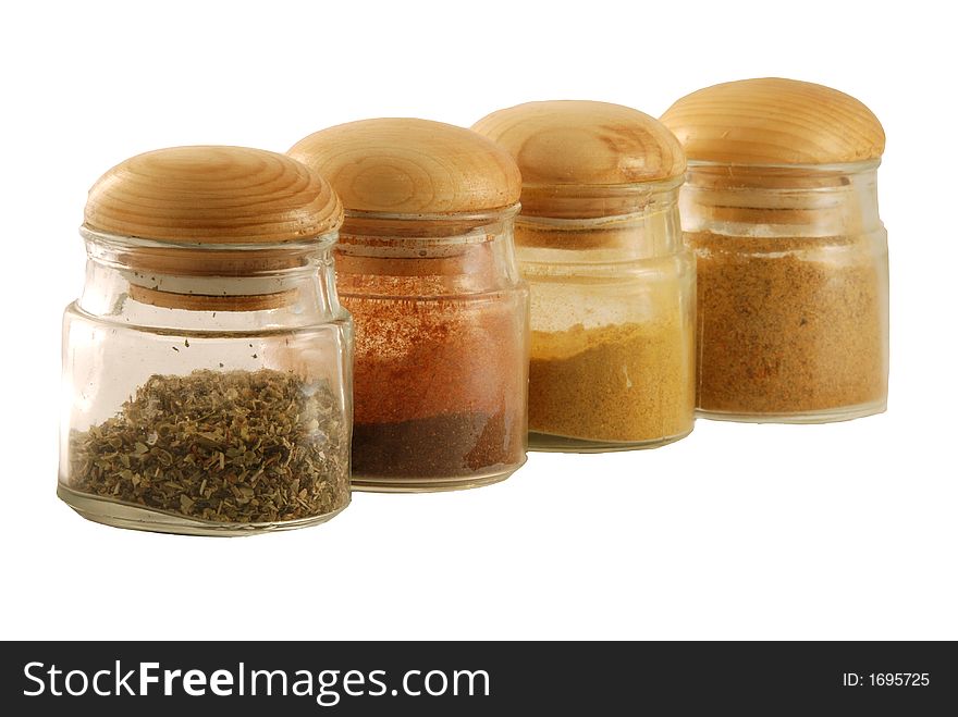 Jars with spices isolated against white background