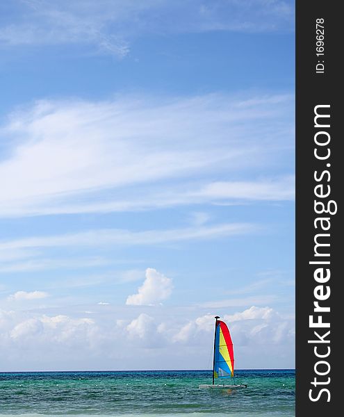 Sailboat on the caribean sea, sunny day with clouds above. Sailboat on the caribean sea, sunny day with clouds above