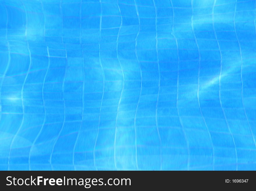 Blue background of a water and tiles found in a pool. Blue background of a water and tiles found in a pool