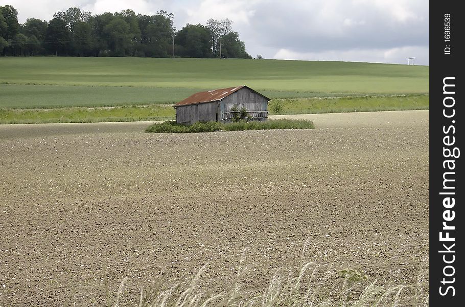 An isolated farm in the very large and spanning normandy countryside. An isolated farm in the very large and spanning normandy countryside