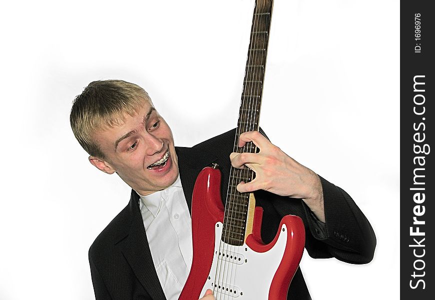 Guy blonde with a red guitar. Guy blonde with a red guitar