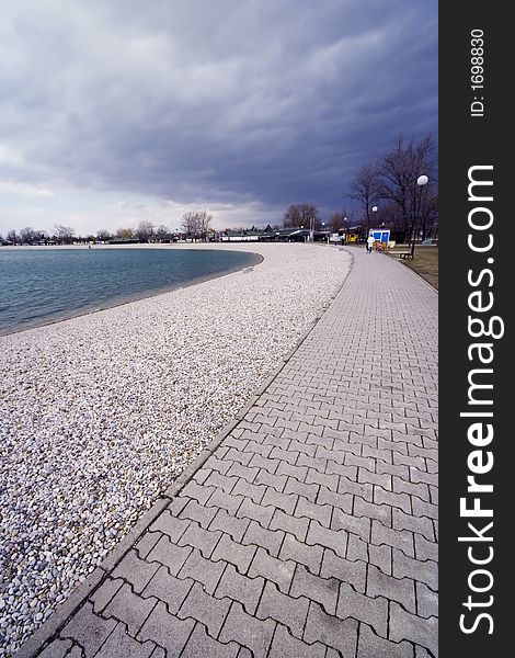 Path around the lake with clouds