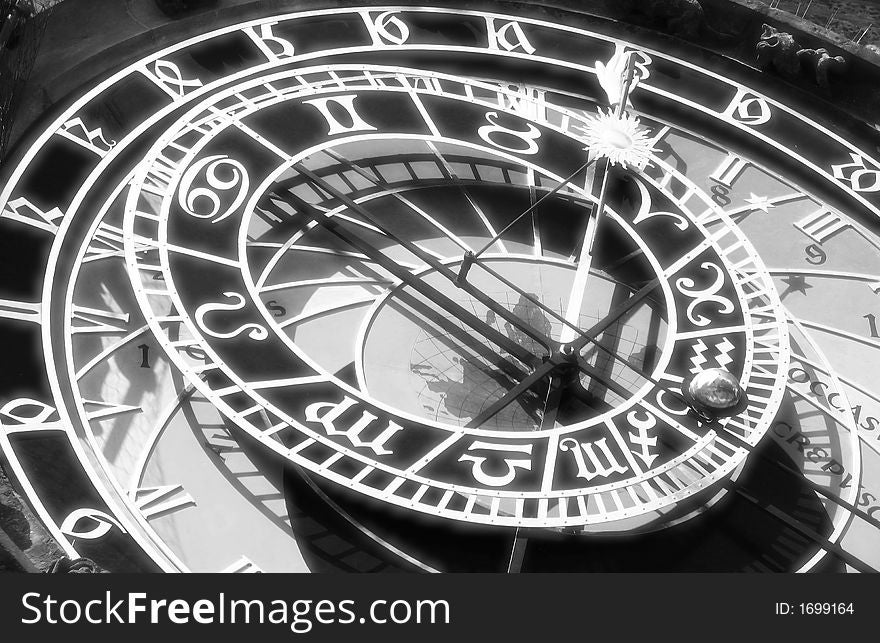 A black and white picture of a clock in Prague