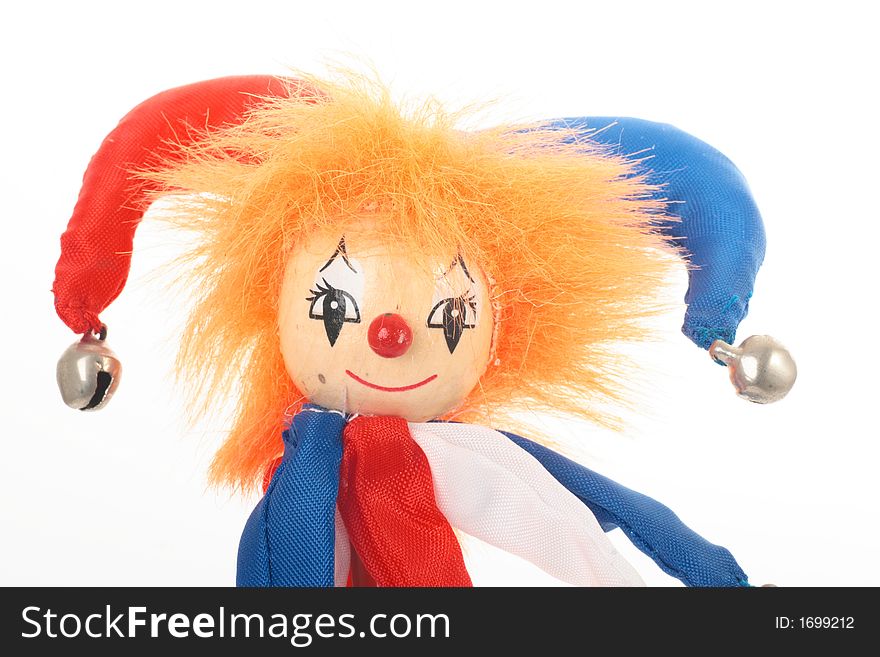 Wooden clown with orange hair and bells