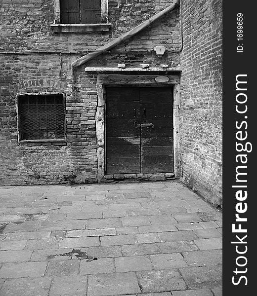 The wooden door of an old house in Venice