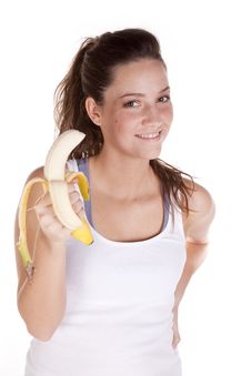 Happy Woman Holding A Banana Royalty Free Stock Images