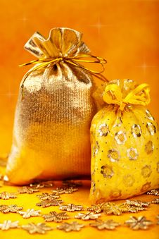 Golden Christmas Gift Sacks And Golden Snowflake Royalty Free Stock Images Golden Christmas Gift Sacks And Golden Snowflake Royalty Free Stock Images