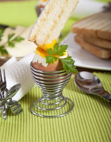 Dipping Roasted Toast In Soft Boiled Egg Royalty Free Stock Image