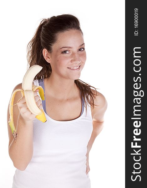 A woman is holding a banana and looking very happy. A woman is holding a banana and looking very happy.