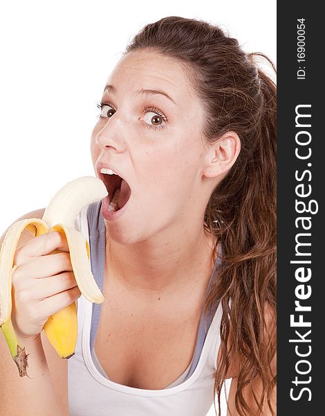 Woman excited about eating a banana close up