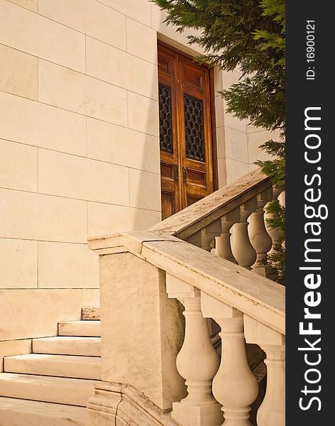 Wooden set of doors at the top of the stairs. Wooden set of doors at the top of the stairs