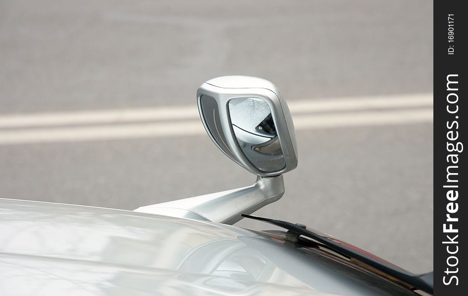 Automobile rear-view mirror attached on a cowl