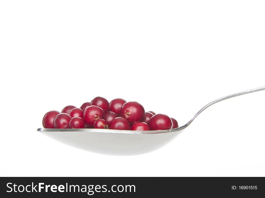Cranberries on spoon,on white background. Cranberries on spoon,on white background.