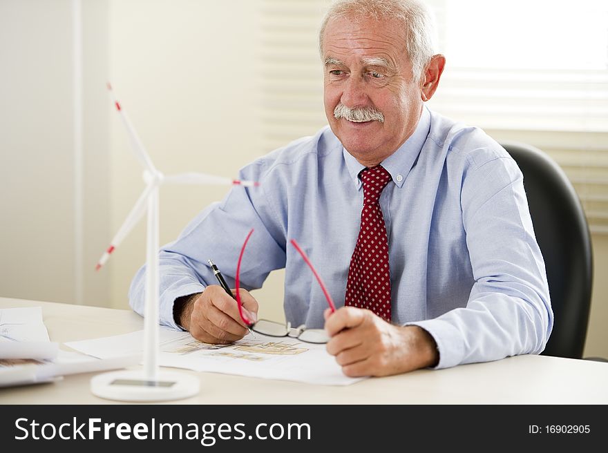 Senior eco engineer projecting new areas with wind turbines