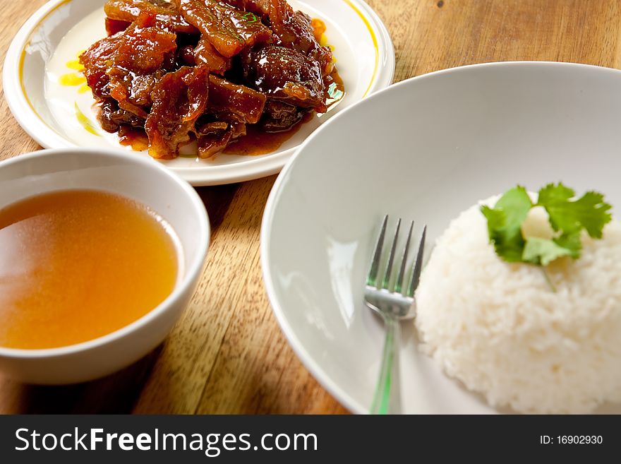 Roast pork with rice and soup.