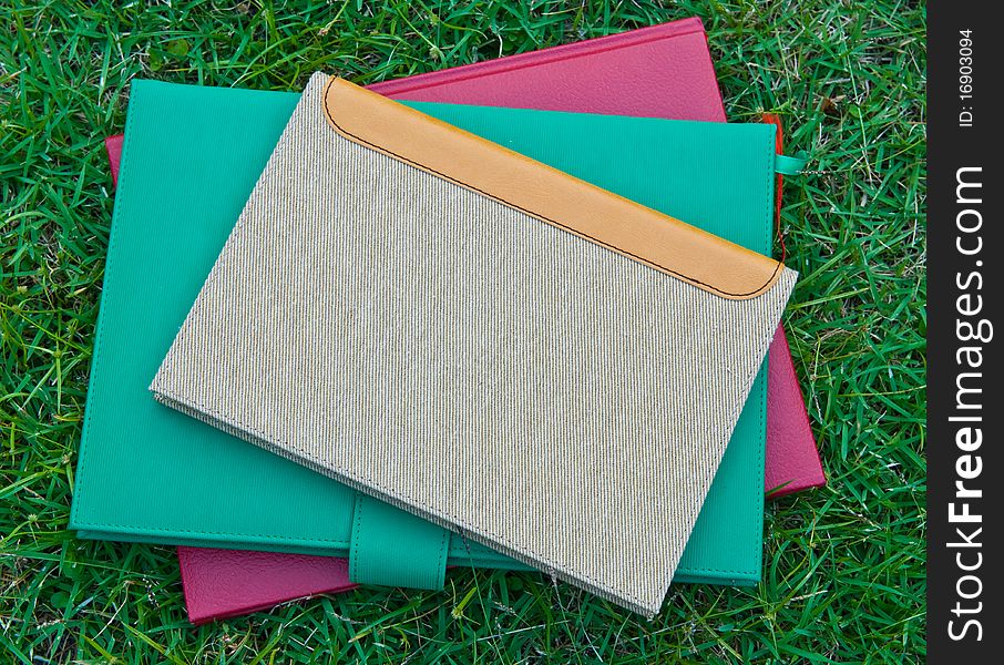 Brown books on the grass