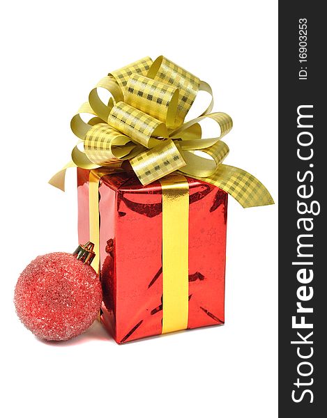 Red gift with ball over white. Red gift with ball over white